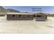 Exterior of home featuring a large covered patio entrance at 13050 N Breeze Way, Maricopa, AZ 85139