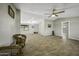 Spacious living room with wood-look floors and plenty of natural light at 13050 N Breeze Way, Maricopa, AZ 85139