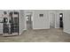 The open floor plan boasts modern flooring and easy access to other rooms at 13050 N Breeze Way, Maricopa, AZ 85139