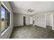Spacious bedroom features wood-look tile floors, ceiling fan, and ample natural light at 13050 N Breeze Way, Maricopa, AZ 85139