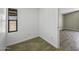 View of a room with wood-look floors and a window at 13050 N Breeze Way, Maricopa, AZ 85139