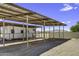 Enclosed trailer storage unit with mountain views, posts, and metal roofing at 13050 N Breeze Way, Maricopa, AZ 85139