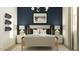 This stylish bedroom features modern decor, including a skateboard art piece and modern lighting at 14949 W Cottontail Ln, Surprise, AZ 85387