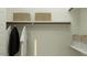 Organized closet featuring built-in shelves, hanging rods, and stylish storage baskets at 14949 W Cottontail Ln, Surprise, AZ 85387