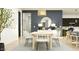 Stylish dining area with modern furnishings and contemporary decor, adjacent to the kitchen at 14949 W Cottontail Ln, Surprise, AZ 85387