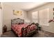 Bedroom featuring carpet floors and a metal bed frame at 15874 W Wildflower Dr, Surprise, AZ 85374