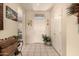 Bright foyer featuring tile flooring, a white front door, and classic decor accents at 15874 W Wildflower Dr, Surprise, AZ 85374