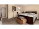 Bedroom with carpet floors and a decorative display at 15874 W Wildflower Dr, Surprise, AZ 85374