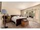 A cozy bedroom with a bay window and carpet at 15874 W Wildflower Dr, Surprise, AZ 85374