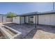 Backyard featuring a covered patio, small garden area, and a storage shed at 1616 E Pecan Rd, Phoenix, AZ 85040