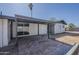 Backyard featuring a covered patio with brick flooring and open space, great for outdoor enjoyment at 1616 E Pecan Rd, Phoenix, AZ 85040