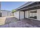 Backyard with covered patio, brick ground covering, and storage shed at 1616 E Pecan Rd, Phoenix, AZ 85040