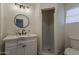 Modern bathroom features a new vanity with a granite countertop and a tiled shower at 1616 E Pecan Rd, Phoenix, AZ 85040
