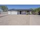 Charming single-story home featuring low maintenance desert landscaping and shaded parking at 1616 E Pecan Rd, Phoenix, AZ 85040