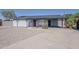 Charming single-story home featuring low maintenance desert landscaping and shaded parking at 1616 E Pecan Rd, Phoenix, AZ 85040