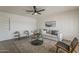 Bright living room with neutral palette, ceiling fan and modern decor at 1616 E Pecan Rd, Phoenix, AZ 85040