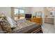 Cozy bedroom with large window, ensuite bathroom, and a comfortable bed at 16354 W Labyrinth Ln, Surprise, AZ 85374