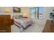 Comfortable bedroom featuring a window view and two bedside tables at 16354 W Labyrinth Ln, Surprise, AZ 85374