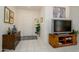 Inviting entryway features neutral-toned walls, tile flooring, and tasteful décor, complete with furniture, artwork, and plants at 16354 W Labyrinth Ln, Surprise, AZ 85374