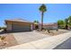 Charming single-story home featuring desert landscaping, a wide driveway and an attached two-car garage at 16354 W Labyrinth Ln, Surprise, AZ 85374