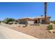 Beautiful single-story home with desert landscaping, a wide driveway, and a two-car garage at 16354 W Labyrinth Ln, Surprise, AZ 85374