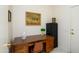 Home office featuring a wood desk, comfortable chair, and neutral walls at 16354 W Labyrinth Ln, Surprise, AZ 85374