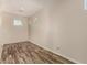 Bright room with wood-look floors, neutral walls, two double-hung windows offering natural light at 17493 N Costa Brava Ave, Maricopa, AZ 85139