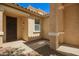 Inviting front entrance featuring a security door and low-maintenance landscaping at 17493 N Costa Brava Ave, Maricopa, AZ 85139