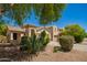 Well-maintained home with desert landscaping and a tile roof, showcasing curb appeal at 17493 N Costa Brava Ave, Maricopa, AZ 85139