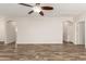 Spacious living area featuring wood-look floors, neutral walls, and ample room at 17493 N Costa Brava Ave, Maricopa, AZ 85139