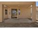 Covered patio with sliding glass doors offers seamless indoor/outdoor living at 17493 N Costa Brava Ave, Maricopa, AZ 85139