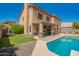 Scenic backyard featuring pool, patio, and well-maintained landscaping, offering a relaxing outdoor space at 1751 W Mulberry Dr, Chandler, AZ 85286