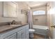 Cozy bathroom featuring granite countertops, decorative mirror, and neutral color palette at 1751 W Mulberry Dr, Chandler, AZ 85286