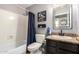This bathroom features a combined tub and shower with an updated sink and vanity at 1751 W Mulberry Dr, Chandler, AZ 85286
