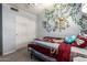 Bedroom with light walls, cozy bed with patterned bedding, and closet at 1751 W Mulberry Dr, Chandler, AZ 85286