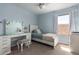 This bedroom features a vanity table with lighting and neutral paint at 1751 W Mulberry Dr, Chandler, AZ 85286