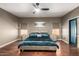 Bedroom with hardwood floors, stylish decor, and two bedside tables at 1751 W Mulberry Dr, Chandler, AZ 85286