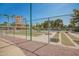 View of a bocce ball court surrounded by palm trees and lush landscaping at 1751 W Mulberry Dr, Chandler, AZ 85286