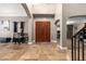 Spacious home foyer featuring high ceilings, travertine floors, and a large double-door entry at 1751 W Mulberry Dr, Chandler, AZ 85286
