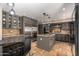 Elegant kitchen featuring an island, stainless steel appliances, and ample cabinet space at 1751 W Mulberry Dr, Chandler, AZ 85286