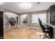 Open-concept living room with stone floors, staircase, and lots of natural light at 1751 W Mulberry Dr, Chandler, AZ 85286