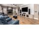 Spacious living room featuring a stone fireplace, modern TV, and comfortable seating at 1751 W Mulberry Dr, Chandler, AZ 85286