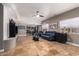 Open-concept living room with stone floors and neutral colors creating a cozy atmosphere at 1751 W Mulberry Dr, Chandler, AZ 85286