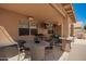 Covered patio with outdoor seating area and ceiling fan, perfect for enjoying the outdoors at 1751 W Mulberry Dr, Chandler, AZ 85286