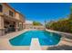 Private backyard pool with diving board, patio, and landscaping perfect for relaxation and recreation at 1751 W Mulberry Dr, Chandler, AZ 85286