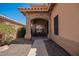 Covered front porch with stone archway and seating area at 1751 W Mulberry Dr, Chandler, AZ 85286