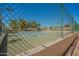 Well-maintained tennis court surrounded by lush greenery, perfect for active recreation at 1751 W Mulberry Dr, Chandler, AZ 85286