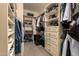 This walk-in closet features custom shelving, drawers, and ample storage space at 1751 W Mulberry Dr, Chandler, AZ 85286