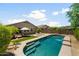 Private backyard oasis with a pool, lounge area, and lush landscaping perfect for outdoor enjoyment at 1812 E Parkside E Ln, Phoenix, AZ 85024