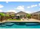 Backyard oasis featuring a refreshing pool, lounge chairs, lush landscaping and patio furniture for relaxation and enjoyment at 1812 E Parkside E Ln, Phoenix, AZ 85024